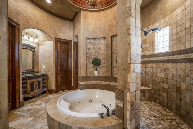 102 Lake Sterling Gate Dr, Spring, TX 77379 - bathroom with a whirlpool tub, a walk in shower, and vanity
