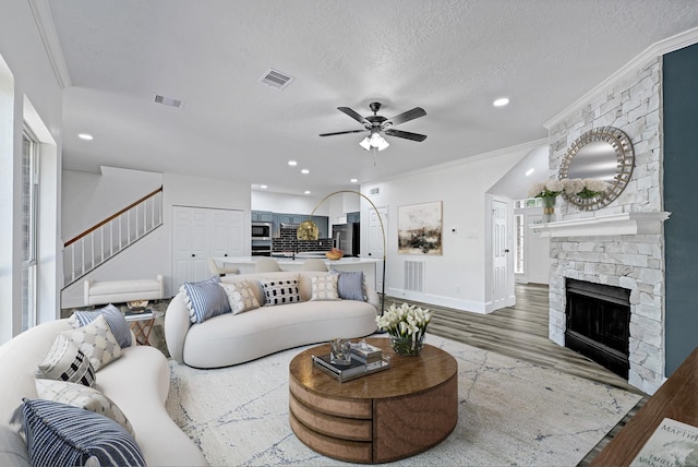 1826 Cheyenne River Cir, Sugar Land, TX 77478 - living area featuring wood finished floors, stairs, a fireplace, a ceiling fan, and recessed lighting