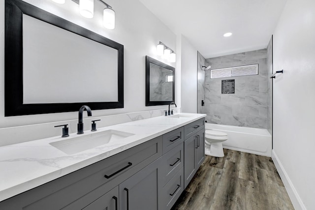 1826 Cheyenne River Cir, Sugar Land, TX 77478 - bathroom featuring double vanity, wood finished floors, bathtub / shower combination, and recessed lighting