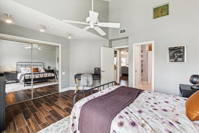 4914 Feagan St, Houston, TX 77007 - bedroom featuring wood finished floors, a closet, a high ceiling, and ceiling fan