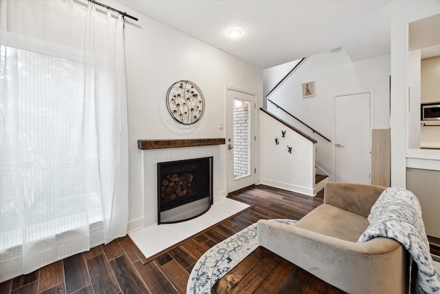 4914 Feagan St, Houston, TX 77007 - living area with stairs, wood finished floors, and a tiled fireplace