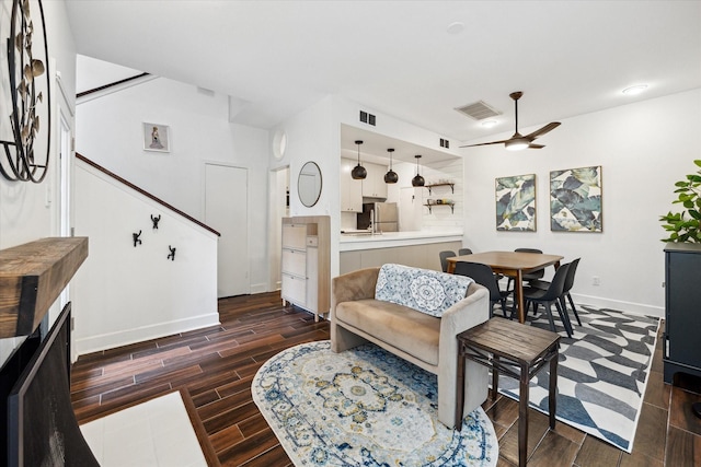 4914 Feagan St, Houston, TX 77007 - living area with a ceiling fan, dark wood finished floors, and stairs