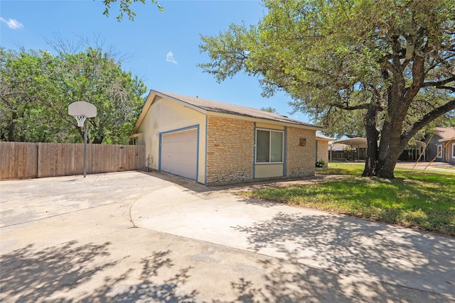 600 Erin Cir, Leander, TX 78641 - ranch-style house with driveway, an attached garage, and stone siding