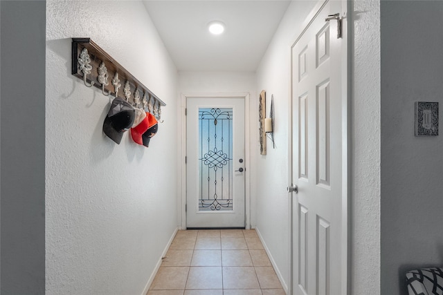 600 Erin Cir, Leander, TX 78641 - doorway to outside featuring light tile patterned flooring and a textured wall