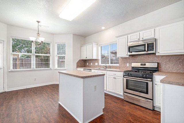 3242 Enchanted Hollow Ln, Spring, TX 77388 - kitchen featuring stainless steel appliances, tasteful backsplash, a chandelier, dark wood-style flooring, and recessed lighting