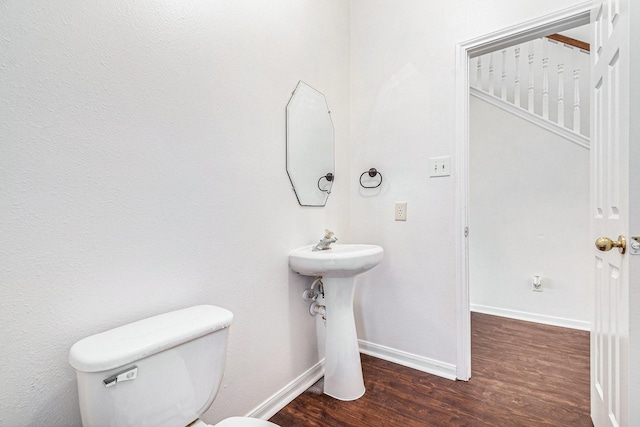 3242 Enchanted Hollow Ln, Spring, TX 77388 - bathroom with wood finished floors and toilet