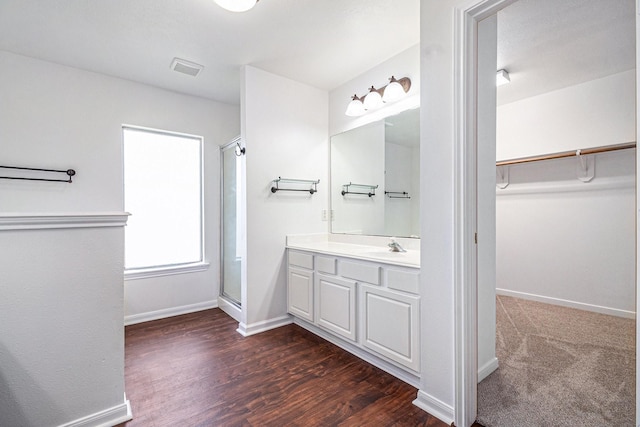 3242 Enchanted Hollow Ln, Spring, TX 77388 - full bath with a walk in closet, a stall shower, vanity, and wood finished floors