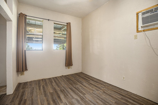 4028 N 1/2 Ave, Santa Fe, TX 77510 - spare room with wood finished floors and a wall mounted AC