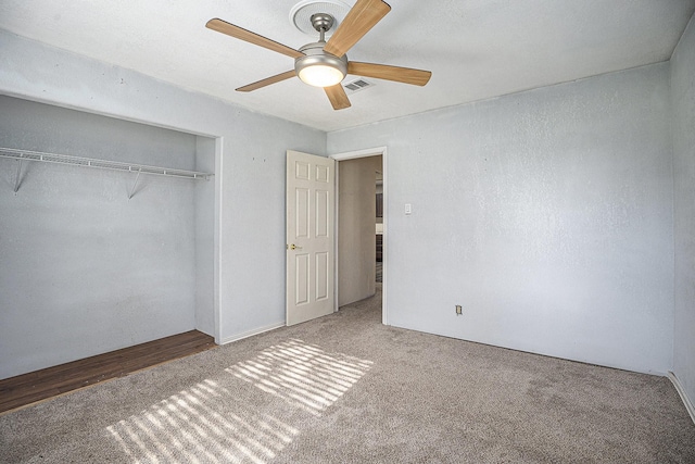 4028 N 1/2 Ave, Santa Fe, TX 77510 - unfurnished bedroom with carpet, a closet, and a ceiling fan