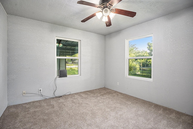 4028 N 1/2 Ave, Santa Fe, TX 77510 - carpeted empty room featuring a textured wall and a ceiling fan