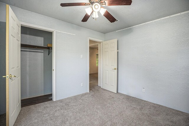 4028 N 1/2 Ave, Santa Fe, TX 77510 - unfurnished bedroom with carpet, a closet, and ceiling fan