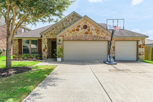2010 Wembley Way, Rosenberg, TX 77471 - view of front of home featuring concrete driveway, an attached garage, a shingled roof, brick siding, and a front yard