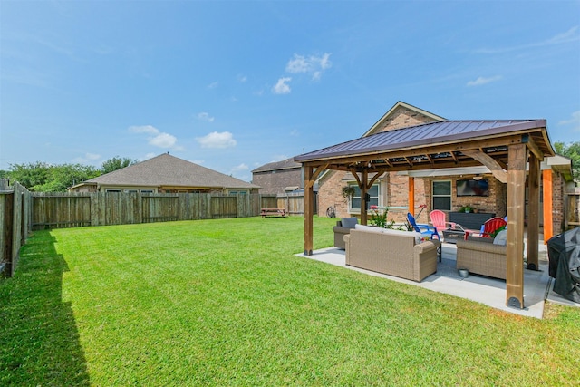 2010 Wembley Way, Rosenberg, TX 77471 - fenced backyard with an outdoor hangout area, a gazebo, and a patio