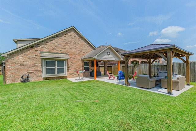 2010 Wembley Way, Rosenberg, TX 77471 - rear view of house with outdoor lounge area, brick siding, a gazebo, a fenced backyard, and a patio