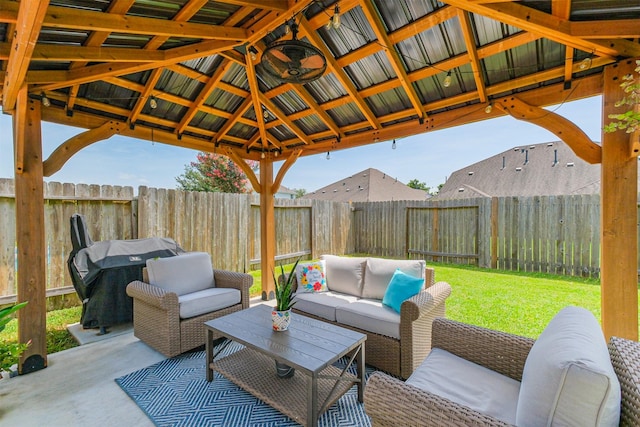 2010 Wembley Way, Rosenberg, TX 77471 - fenced backyard featuring an outdoor hangout area, a grill, a patio area, and a gazebo