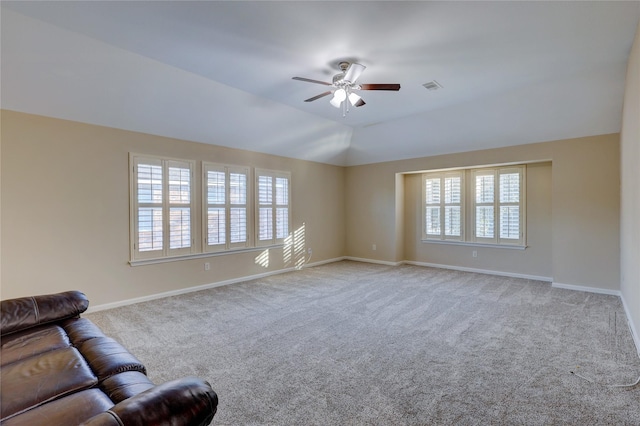5507 Opal Cove Ct, Katy, TX 77494 - unfurnished living room featuring ceiling fan, carpet floors, and vaulted ceiling