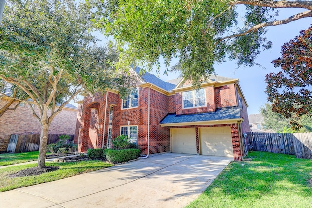 5507 Opal Cove Ct, Katy, TX 77494 - traditional-style house featuring a garage, concrete driveway, brick siding, and a shingled roof