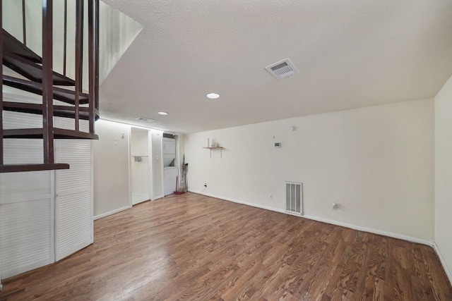 4723 Aftonshire Dr Unit 15, Houston, TX 77027 - unfurnished living room featuring wood finished floors, recessed lighting, and a textured ceiling
