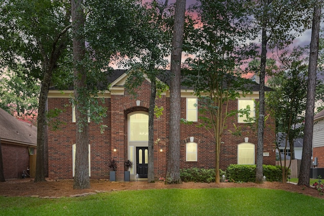 22 Windfern Pl, The Woodlands, TX 77382 - view of front of property featuring brick siding and a yard