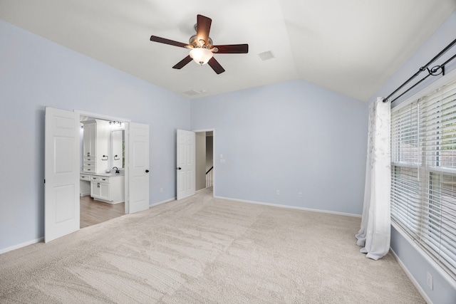 22 Windfern Pl, The Woodlands, TX 77382 - unfurnished bedroom with light carpet, vaulted ceiling, a ceiling fan, and ensuite bath