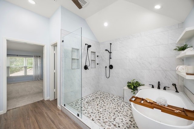 22 Windfern Pl, The Woodlands, TX 77382 - bathroom with a freestanding bath, walk in shower, vaulted ceiling, recessed lighting, and wood finished floors