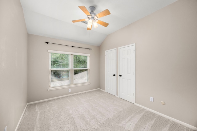 22 Windfern Pl, The Woodlands, TX 77382 - unfurnished bedroom with vaulted ceiling, carpet flooring, and a ceiling fan