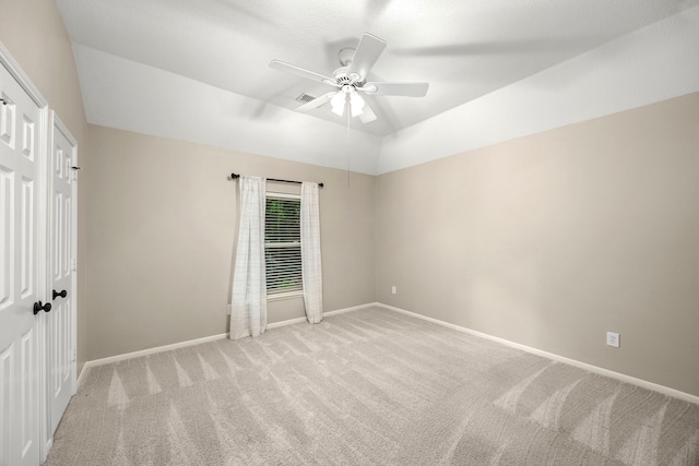 22 Windfern Pl, The Woodlands, TX 77382 - unfurnished bedroom featuring light carpet, vaulted ceiling, and ceiling fan