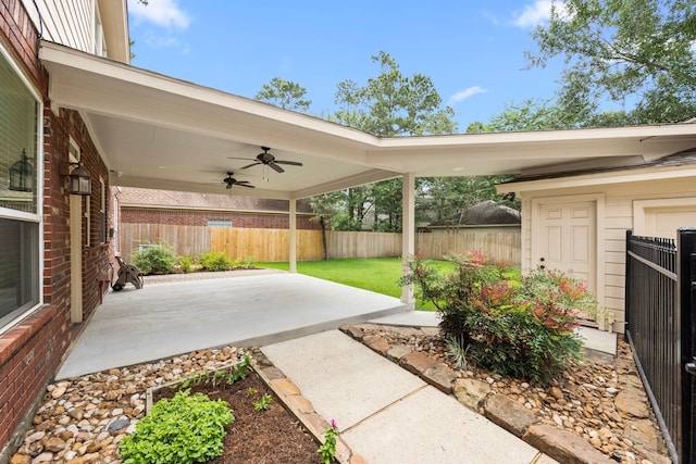 22 Windfern Pl, The Woodlands, TX 77382 - fenced backyard featuring ceiling fan and a patio