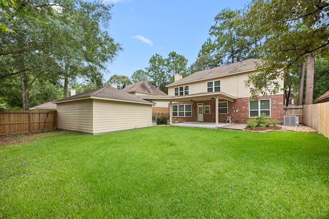 22 Windfern Pl, The Woodlands, TX 77382 - rear view of house featuring a patio, a fenced backyard, brick siding, a chimney, and an outdoor structure