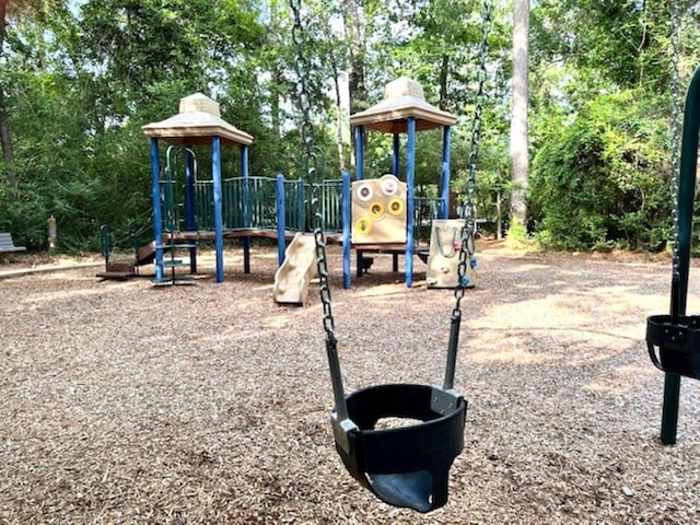 22 Windfern Pl, The Woodlands, TX 77382 - community play area with view of wooded area