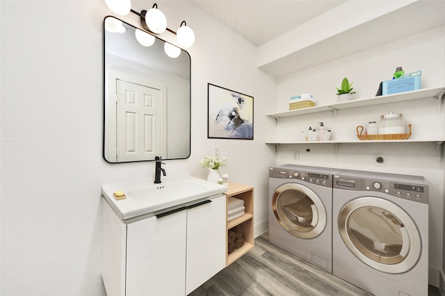 5817 Beechnut St, Houston, TX 77074 - washroom with washing machine and dryer and wood finished floors