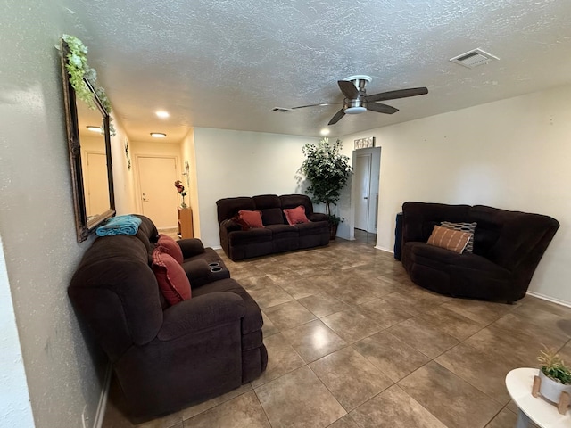 7431 Water Park Ln, Houston, TX 77086 - tiled living area with ceiling fan and a textured ceiling