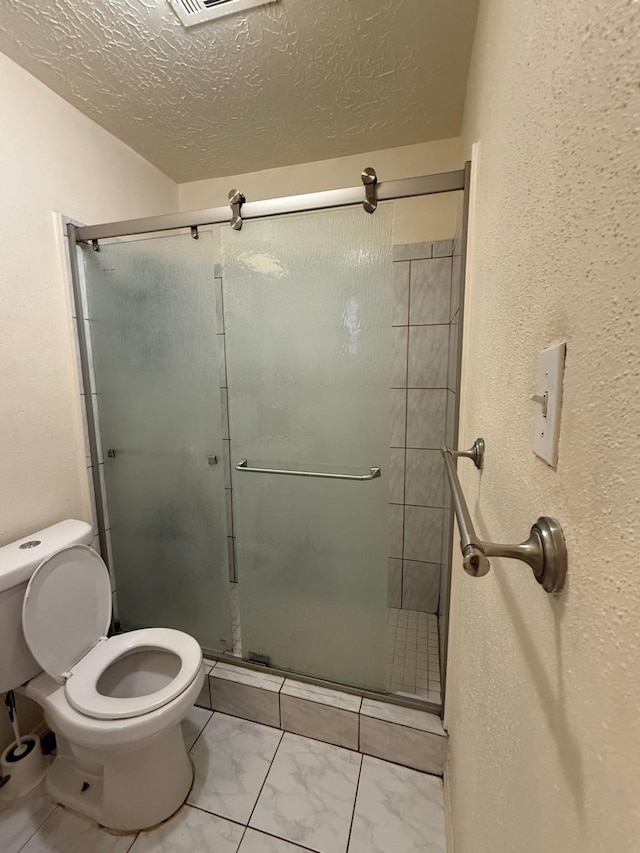 7431 Water Park Ln, Houston, TX 77086 - full bath with a stall shower, marble look tiles, and a textured ceiling