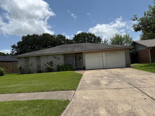 7431 Water Park Ln, Houston, TX 77086 - ranch-style home with brick siding, an attached garage, and concrete driveway