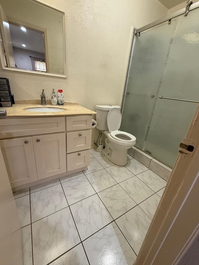 7431 Water Park Ln, Houston, TX 77086 - full bathroom with vanity, a shower stall, and marble look tile flooring