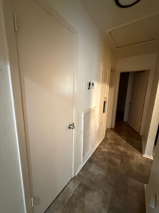 7431 Water Park Ln, Houston, TX 77086 - corridor with dark tile patterned flooring