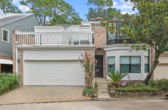 12013 Naughton St, Houston, TX 77024 - view of front of home with a balcony and driveway