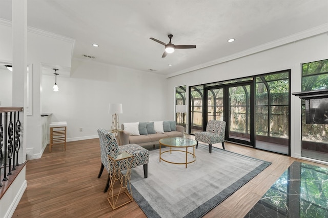 12013 Naughton St, Houston, TX 77024 - living area with plenty of natural light, ornamental molding, a ceiling fan, wood finished floors, and recessed lighting