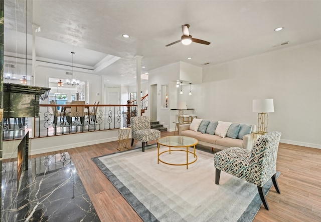 12013 Naughton St, Houston, TX 77024 - living area with a ceiling fan, stairs, recessed lighting, wood finished floors, and crown molding