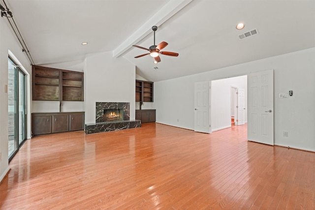 12013 Naughton St, Houston, TX 77024 - unfurnished living room with light wood-style flooring, a ceiling fan, a fireplace, and recessed lighting