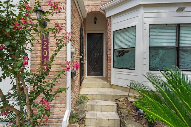 12013 Naughton St, Houston, TX 77024 - view of exterior entry featuring brick siding