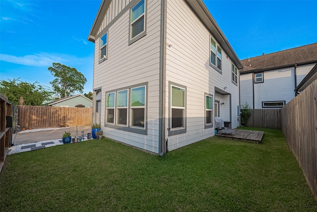 209 Blueberry St, Houston, TX 77018 - rear view of house featuring a fenced backyard, a wooden deck, and board and batten siding