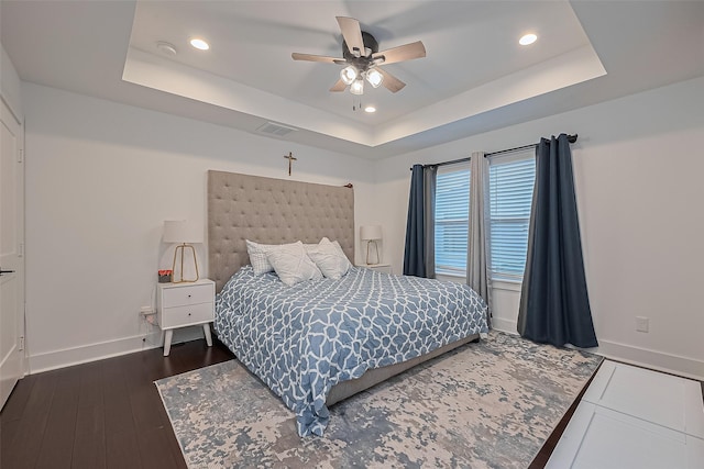 209 Blueberry St, Houston, TX 77018 - bedroom featuring a tray ceiling, recessed lighting, dark wood-style floors, and ceiling fan
