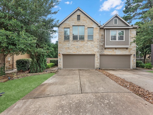 211 Cheswood Forest Pl, Montgomery, TX 77316 - view of front of property with stone siding, concrete driveway, an attached garage, and a front lawn