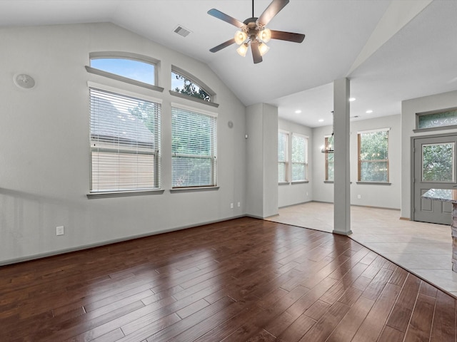 211 Cheswood Forest Pl, Montgomery, TX 77316 - empty room with wood finished floors, plenty of natural light, lofted ceiling, ceiling fan, and recessed lighting