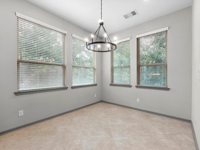211 Cheswood Forest Pl, Montgomery, TX 77316 - spare room featuring a chandelier and tile patterned floors