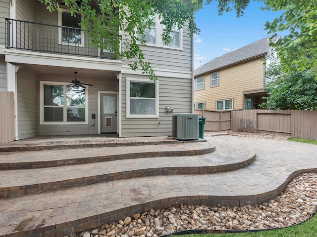 211 Cheswood Forest Pl, Montgomery, TX 77316 - back of property featuring a balcony, a patio, a ceiling fan, and a fenced backyard
