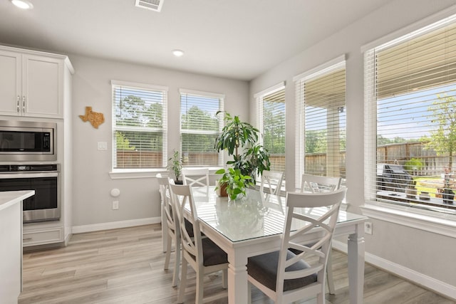 503 Highland Thicket Dr, Conroe, TX 77316 - dining room with light wood-style floors and recessed lighting