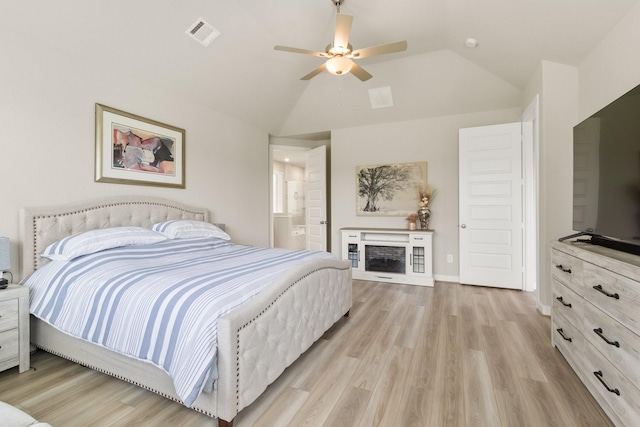 503 Highland Thicket Dr, Conroe, TX 77316 - bedroom featuring light wood-type flooring, vaulted ceiling, ceiling fan, and ensuite bath