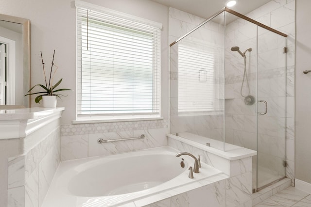 503 Highland Thicket Dr, Conroe, TX 77316 - bathroom featuring a garden tub, healthy amount of natural light, a stall shower, and marble finish floors